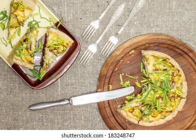 Pie quiche with leeks, cheese and sour cream on rough linen tablecloth From series Homemade bread - Shutterstock ID 183248747