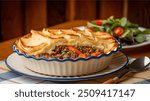 Shepherd’s Pie: Savory pie filled with ground lamb or beef, mixed vegetables, and topped with creamy mashed potatoes. Baked until golden, it