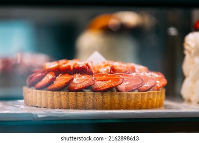 Pie With Strawberries, Assortment Baked Pastry In Bakery. Various Different Types Of Sweet Cakes In Pastry Shop Glass Display. Good Assortment Of Confectionery.