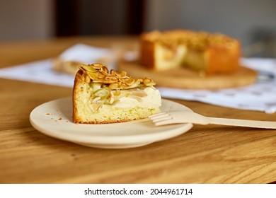 Piece of apple or pear pie, tart with caramel nuts on wooden table, copy space, top view. - Powered by Shutterstock