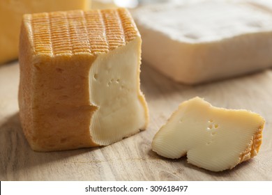 Piece Of Belgian Limburger Cheese On A Cheese Board