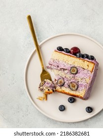 A Piece Of Berry Cake, Berry Sponge Cake With Fresh Berries And Sour Cream On A White Background