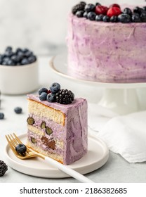 A Piece Of Berry Cake, Berry Sponge Cake With Fresh Berries And Sour Cream On A White Background