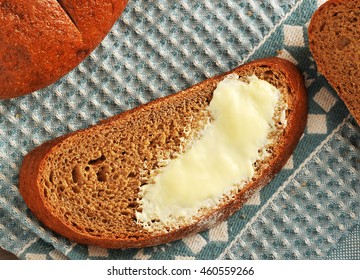 Piece Of Bread With Butter Closeup Shot. The View From The Top