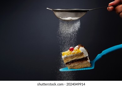 
Piece Of Cake Covered With Icing Sugar