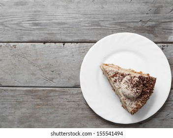 Piece Of Cake On The Wooden Table, Top View, Space For Text