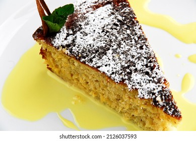 Piece of cake, slice of cake with icing and eggnog or eggnog, close up view