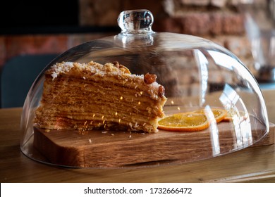 A Piece Of Cake Under The Glass Cover. 