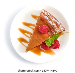 Piece Of Caramel Cheesecake Isolated On White Background, Top View