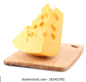 Piece Of Cheese On Plate, On Wooden Board, Isolated On White