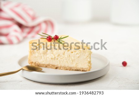 a piece of cheesecake on a white table. space for text