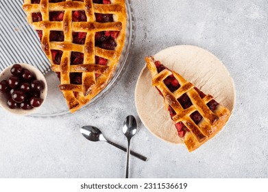 Piece of Cherry Pie with a Flaky Crust on light background. Top view. American pie. Cherry dessert. Flatlay. Cherry filling. - Shutterstock ID 2311536619