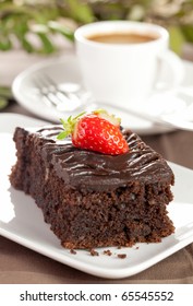 A Piece Of Chocolate Cake With Coffee