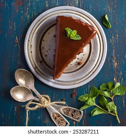 Piece Of Chocolate Cake With Mint Leaves, Top View