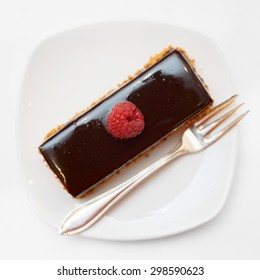 Piece Of Chocolate Cake In Small Plate Shot From Above