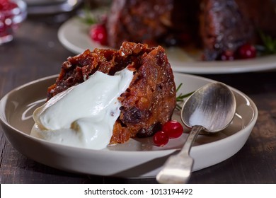 Piece Of Christmas Pudding With Whipped Cream