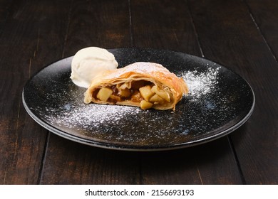 Piece of classic apple strudel on a plate