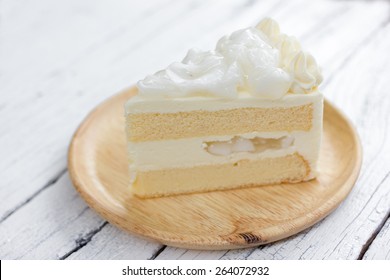 a piece of coconut cake on dish.