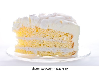 A piece of coconut cake on white background