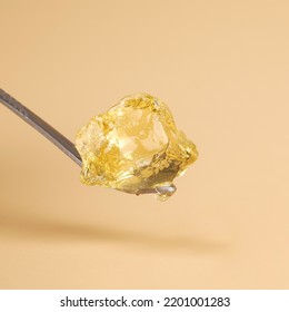 A Piece Of Concentrated Cannabis Wax , High Thc Golden Dab.