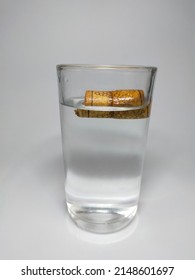 A piece of cork floats on water because the density of cork is less than the density of water.