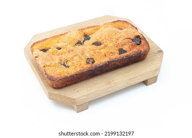 Piece Of Craft Cornbread Home Made Johnny Bread Made Of Corn Flour And Fig Pieces On A Wooden Cutting Board Isolated On A White Background