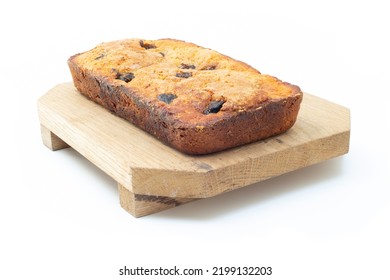 Piece Of Craft Cornbread Home Made Johnny Bread Made Of Corn Flour And Fig Pieces On A Wooden Cutting Board Isolated On A White Background