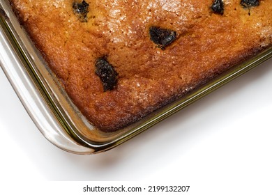 Piece Of Craft Cornbread Home Made Johnny Bread Made Of Corn Flour And Fig Pieces In A Glass Refractory For Baking From Above Isolated On A White Background