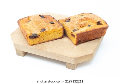 Piece Of Craft Cornbread Home Made Johnny Bread Made Of Corn Flour And Fig Pieces On A Wooden Cutting Board Isolated On A White Background