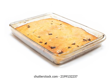 Piece Of Craft Cornbread Home Made Johnny Bread Made Of Corn Flour And Fig Pieces In A Glass Refractory For Baking Isolated On A White Background