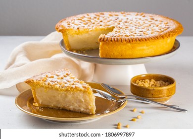 A Piece Of Custard Cream Cake With Pine Nuts. Traditional Italian Cake - Torta Della Nonna Or Grandmother's Cake. Tuscany Pastry.