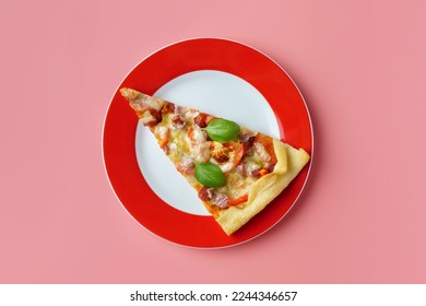 A piece of delicious homemade pizza on a plate on a pink background, close-up. - Shutterstock ID 2244346657