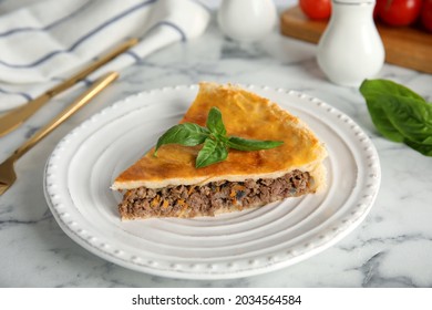 Piece Of Delicious Pie With Minced Meat On White Marble Table