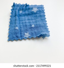 A Piece Of Double-layer Cotton Gauze Muslin Fabric. Blue Fabric Swatch On White Background. 