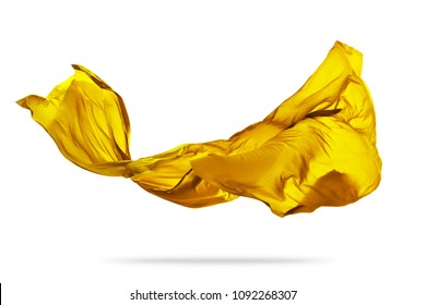 Piece of flying golden cloth isolated on white background. High resolution image