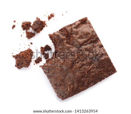 Piece of fresh brownie on white background, top view. Delicious chocolate pie
