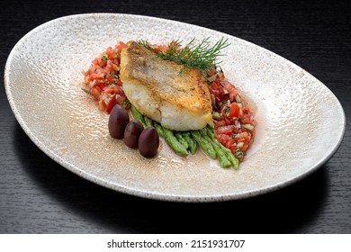 A piece of fried fish pike perch with vegetables, fillet