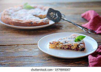 Piece Of Homemade Simple Pie With Fresh Red Raspberries And Black Mulberry On A Dark Wooden Rustic Background. Summer Berry Dessert. Sugar Powder.