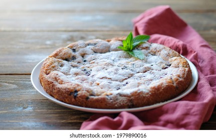 Piece Of Homemade Simple Pie With Fresh Red Raspberries And Black Mulberry On A Dark Wooden Rustic Background. Summer Berry Dessert. Sugar Powder.