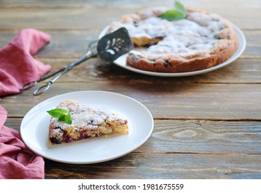 Piece Of Homemade Simple Pie With Fresh Red Raspberries And Black Mulberry On A Dark Wooden Rustic Background. Summer Berry Dessert. Sugar Powder.