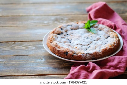 Piece Of Homemade Simple Pie With Fresh Red Raspberries And Black Mulberry On A Dark Wooden Rustic Background. Summer Berry Dessert. Sugar Powder.