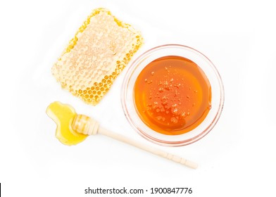 Piece Of Honeycomb, Organic Fresh Liquid Honey With Dipper Isolated On White Background, Healthy Food