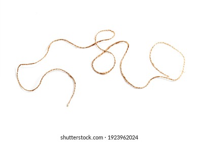 Piece of jute twine isolated on white background. Natural rope for packaging and decoration. Coarse linen threads. Hemp twine.