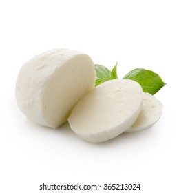 Piece of mozzarella Buffalo isolated on white background with clipping path. Decorated with basil. Front view.