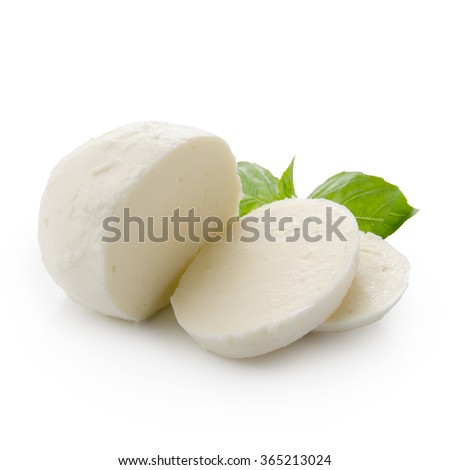 Piece of mozzarella Buffalo isolated on white background with clipping path. Decorated with basil. Front view.