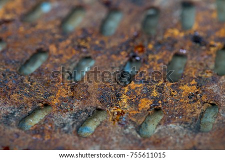 A piece of old engine car spare part. Rusty iron surface. The rust on steel Texture. Decay metal object.