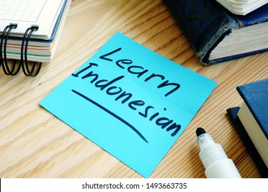 Piece of page with inscription Learn Indonesian language. - Shutterstock ID 1493663735