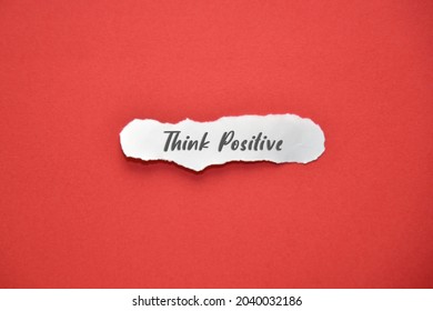 Piece Of Paper With THINK POSITIVE Text On And Red Background. Lifestyle Concept.