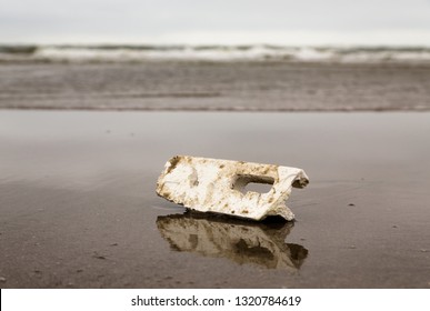
a piece of polystyrene marine litter on the beach