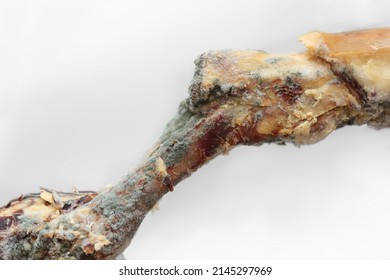 Piece of rotten meat with mold, fungus and bacteria. Decomposing rotten piece of pork meat. - Shutterstock ID 2145297969